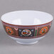 A white Thunder Group melamine bowl with colorful peacock designs.