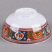 A white melamine bowl with colorful peacock designs.