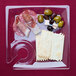 A WNA Comet clear plastic square cocktail plate with meat and cheese on it.