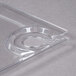 A clear plastic square plate with a curved edge and a circular cup holder.
