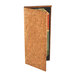 A Menu Solutions natural cork menu cover with a book inside.