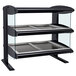 A black and silver Hatco countertop heated display case with glass shelves.