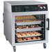 A Hatco Flav-R-Savor holding cabinet with trays of food.
