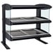 A black and silver Hatco heated countertop display case with glass shelves.