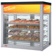 A Hatco Flav-R-Savor countertop display case with pastries inside.