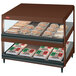 A Hatco Antique Copper countertop food warmer with slanted shelves displaying food.