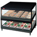 A black Hatco countertop display case with food on double shelves.