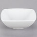 A Tuxton TuxTrendz white square china bowl on a gray background.
