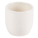 A white porcelain sake cup with a white background and a white rim.