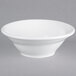 A Tuxton TuxTrendz bright white china bowl with a spiral design on the rim.
