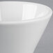 A close-up of a Tuxton Linx bright white bouillon cup with a small rim.