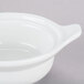 A Tuxton bright white china casserole with 2 lug handles.