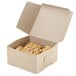 A Kraft bakery box filled with pastries.