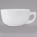 A Tuxton bright white cappuccino cup with a handle.