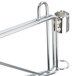 A close-up of a chrome Metro wall mount shelf support.