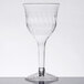 A Fineline clear plastic wine goblet with a stem.
