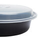 A black Pactiv plastic container with a lid.