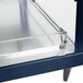 A navy blue stainless steel Hatco dual shelf food warmer with a glass door on a countertop.