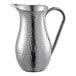An American Metalcraft stainless steel water pitcher with a handle.