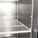A close-up of the shelves inside a Turbo Air M3 Series reach-in refrigerator.