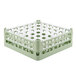A light green plastic Vollrath glass rack with compartments.