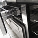 A Turbo Air stainless steel pizza prep table with an open drawer.