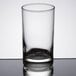 A close-up of a Libbey customizable juice glass on a reflective surface.