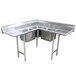 A stainless steel Advance Tabco three compartment corner sink with two drainboards.