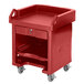 A red plastic Cambro Versa Cart with shelves and standard casters.