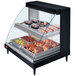 A Hatco Glo-Ray double shelf countertop hot food display case with food inside.