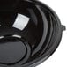 A Fineline black plastic bowl with a lid.