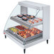 A Hatco Glo-Ray countertop double shelf hot food display case with food inside.