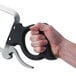 A hand holding a Weston stainless steel butcher hand meat saw with a black handle.