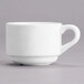 A white Tuxton San Marino AlumaTux espresso cup with a handle.