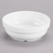 A white Tuxton AlumaTux bowl on a gray surface.