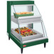 A Hatco green rectangular food display case with double shelves holding food trays.