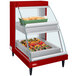 A red Hatco countertop food display case with food inside.