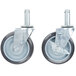 Four black Advance Tabco EC-26 poly casters with rubber wheels.