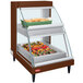 A Hatco countertop hot food display warmer with food in a rectangular container.