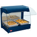 A blue Hatco countertop food warmer with trays of food and a glass cover.