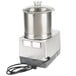 A silver and black Robot Coupe food processor with a metal bowl and lid.