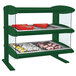 A green Hatco countertop heated zone display case with food on shelves.