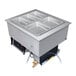 A Hatco dual temperature food well with five trays in a counter.