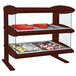 A Hatco Antique Copper heated countertop display case with food on shelves.