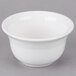 A white Fiesta china bouillon bowl on a gray surface.