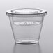 A Squat clear plastic parfait cup with a Fabri-Kal insert and flat lid.