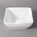 A 10 Strawberry Street Whittier white square porcelain bowl on a gray background.