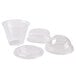 A clear plastic Squat Parfait Cup with two types of lids and a Fabri-Kal insert.