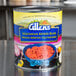 A #10 can of Allens Vegetarian Refried Beans on a table.