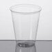 A Solo Ultra Clear clear plastic cup on a white surface.